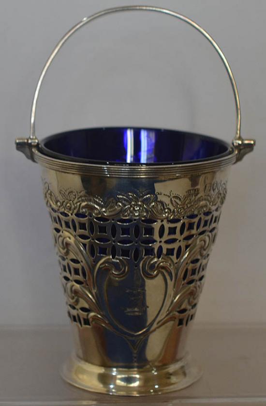 DECORATIVE VICTORIAN SILVER PALE WITH BLUE GASS LINER.