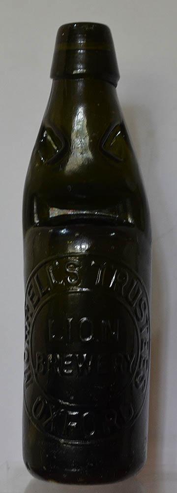 BLACK GLASS CODD BOTTLE, MORRELLS OXFORD.