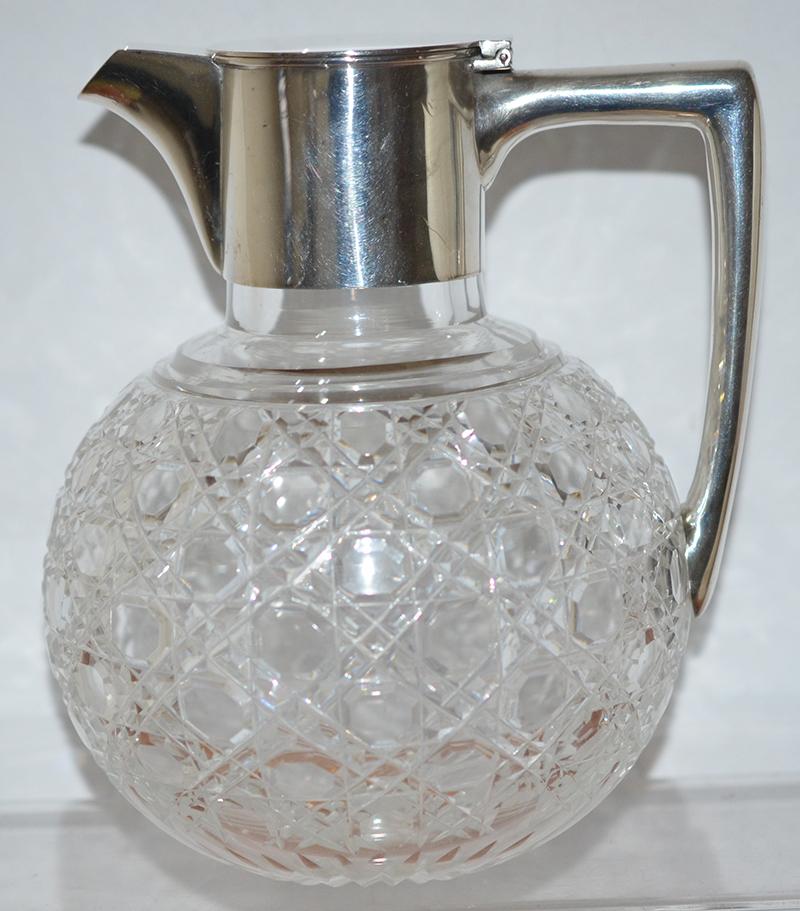 VICTORTIAN SILVER AND CUT GLASS CLARET JUG.
