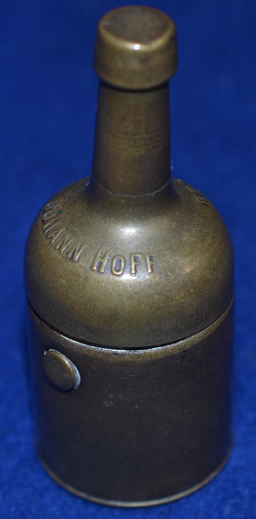 TRAVELLING ADVERTISING INK WELL DESIGNED AS A BOTTLE.