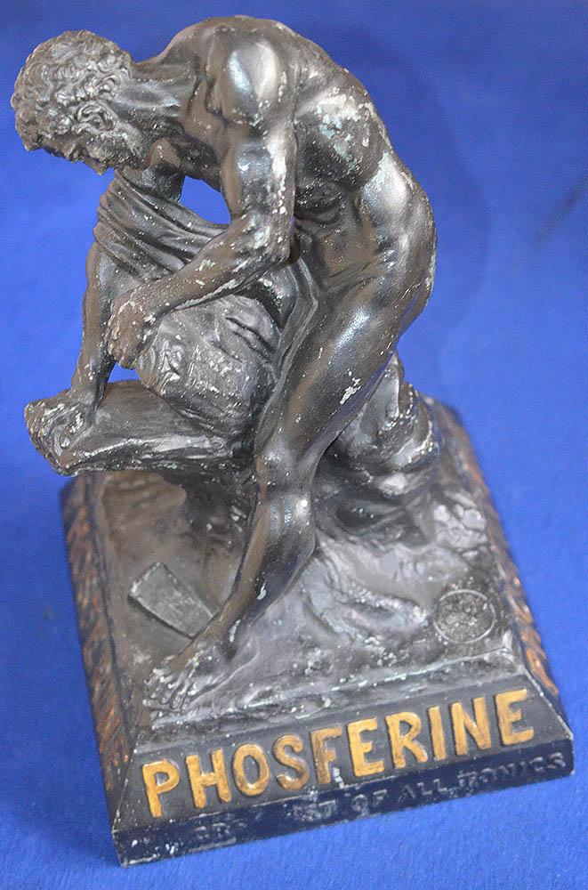 ADVERTISING FIGURE FOR PHOSFERINE TONIC DRINK.