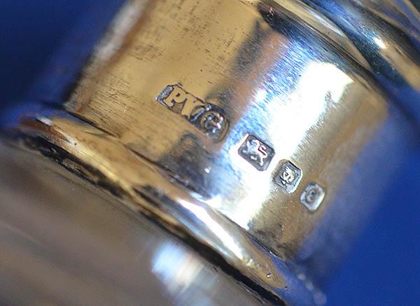 CASED SET OF FOUR ENGLISH SILVER AND GLASS SCENT BOTTLES.